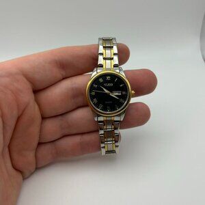 Vintage black face women’s watch with two toned band!